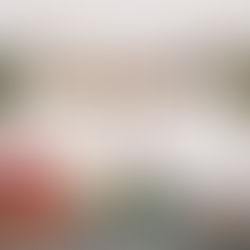 Metal letter spelling JOY sitting on a scaffolding shelf in a kitchen above a red Kitchenaid mixer