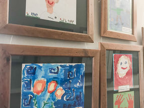 Framed Kids artwork displayed in hallway