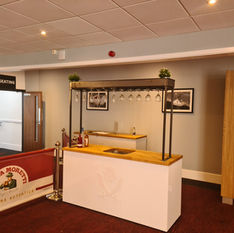 Display units with metal top glass holders