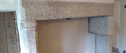 lime plastering on stone fireplace