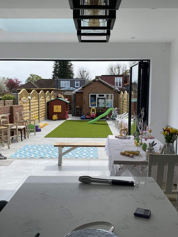 Open concertina sliding doors to the garden