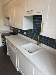 Modern white kitchen with quartz countertops