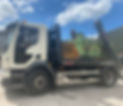 Skip hire truck is lifting a skip bin under a blue sky
