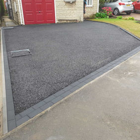 Tarmac driveway in front of garage
