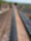 Roof ridge repair with solar panels on the roof.JPEG