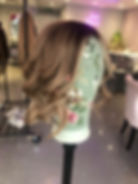 Brown wig on a stand