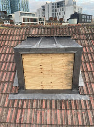 Boarded up dormer window