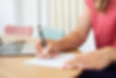 doctor helen writing a prescription, she is a physician, a family doctor, working in el Maresme and Barcelona area, she offers medical help in English, Spanish and Dutch, for expats, tourists, international community