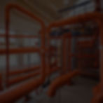 interior of building site with large plumbing installation pips.jpg