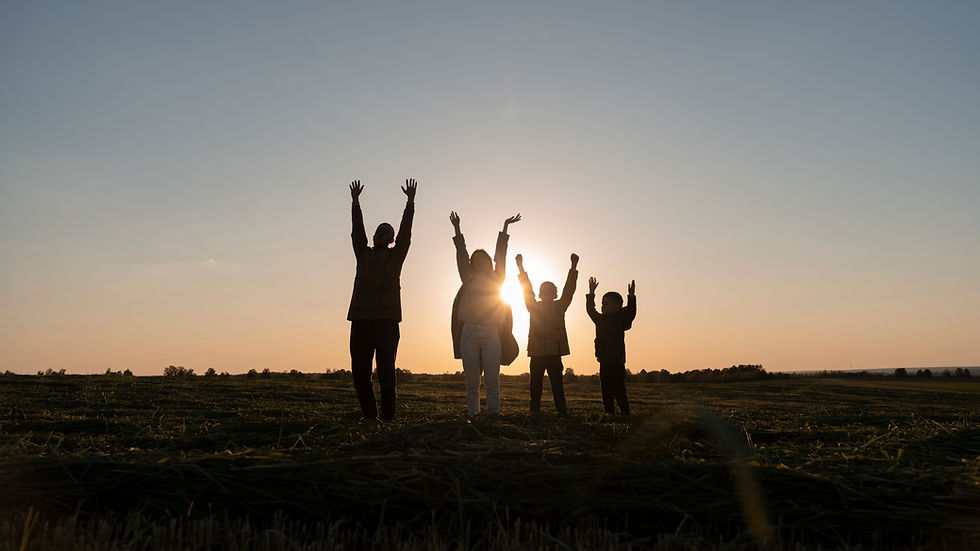 family-silhouettes-having-fun-sunset-full-shot.jpg