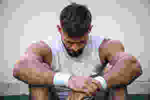 tired athlete male gymnast