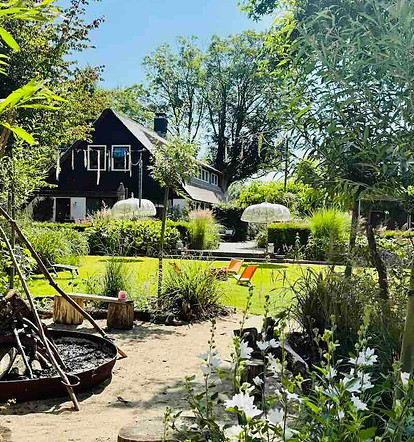 Peaceful retreat garden with walking paths, greenery and the countryside retreat centre.jp