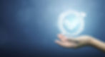 A hand holding a glowing circle