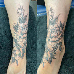 Black and gray floral tattoo