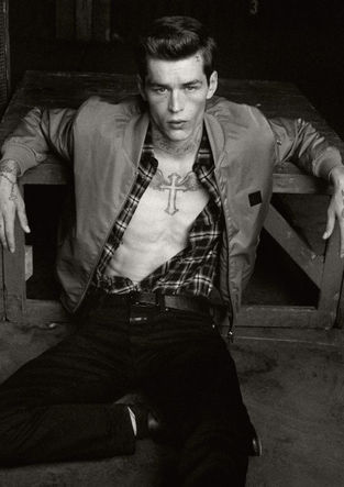 Norman Theuerkorn male model, three-quarter B&W, layered casual styling, natural light outdoor