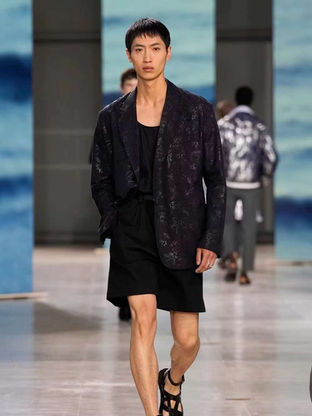 Ann Taiheng on the Hermès Spring Summer 2025 runway, presenting a minimalist silhouette with refined craftsmanship.