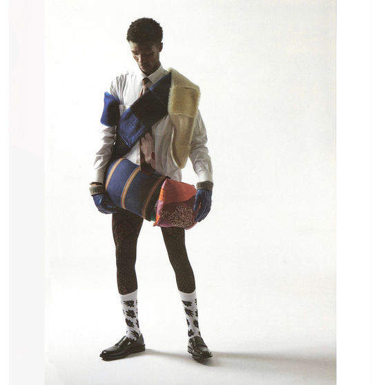 Model in layered clothing and accessories