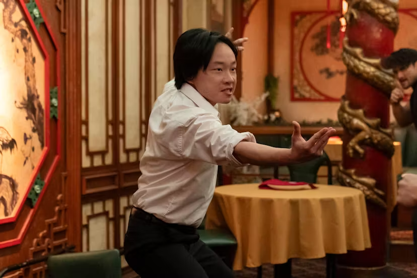 One of the actors stands posed for action
