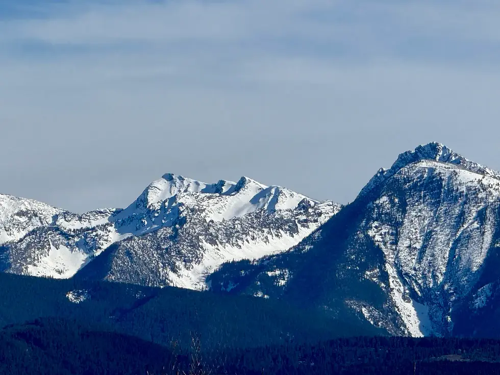 Snow-capped mountain peaks under a clear sky