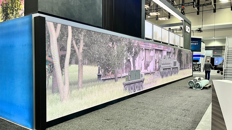 Large LED display at home exhibition showing garden scene.