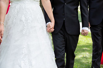 Wedding couple holding hands
