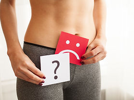 young-woman-holds-paper-with-sad-smile-