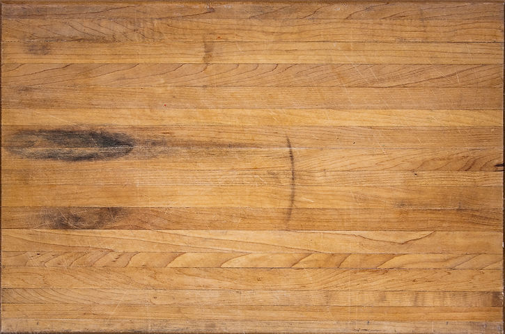 A worn butcher block cutting board sits as a background.jpg