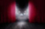 The red curtains are opening for the theater show.jpg
