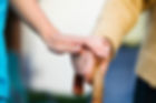 Doctor holding a senior patients 's hand on a walking stick - special medical care concept