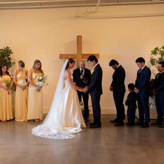bride and groom praying at their wedding ceremony 