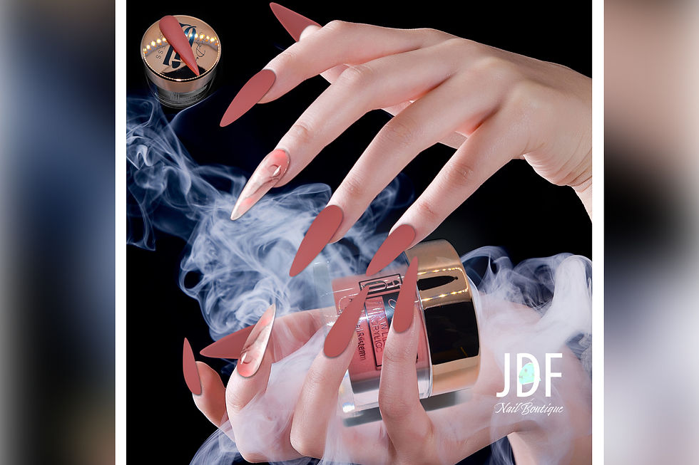 a female's hands showing her nails done in red acrylic powder