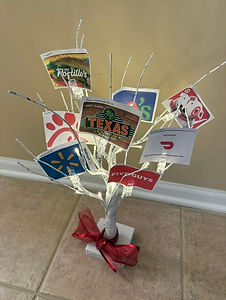 Gift card money tree featuring Texas Roadhouse, Portillo’s, Walmart, Target, DoorDash, Chili’s, Five Guys, and Chick-fil-A gift cards.