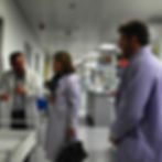 NKMT team visiting the University of Manchester lab to discuss brain haemorrhage research findings