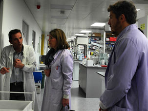 NKMT team visiting the University of Manchester lab to discuss brain haemorrhage research findings