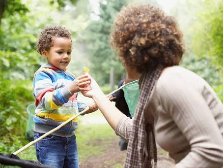 A child and parent on a treasure hunt to support language development.