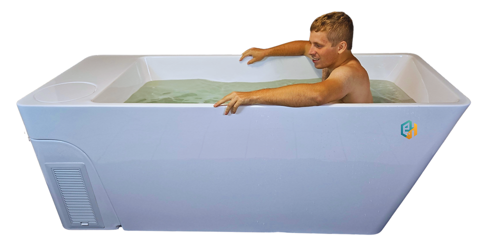 Person seated in an all-in-one cold plunge tub filled with water, showing fit and depth of the white Haven One model.