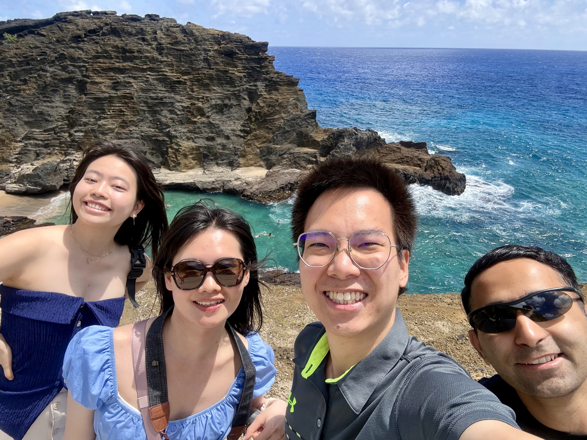 Group beside a rocky coast during the MRS Spring Meeting in Hawaii