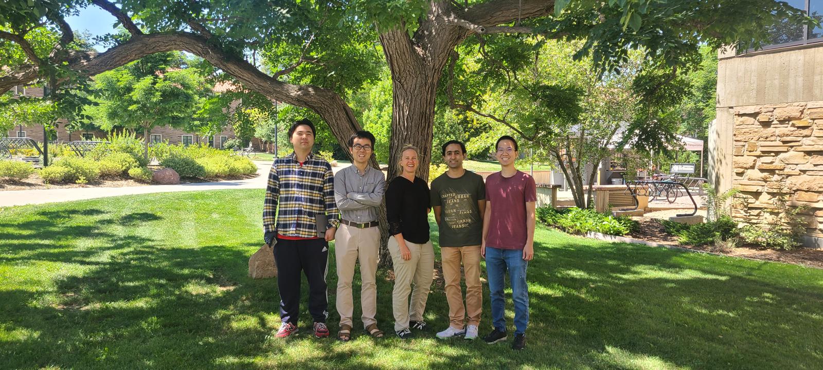 Lab Venture Challenge celebration beneath a tree on campus