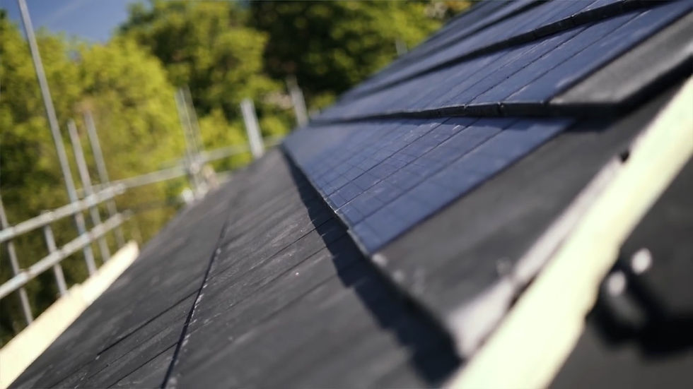 Close up of residential roof fully installed with ICON by VOLTAIC solar roof tiles.