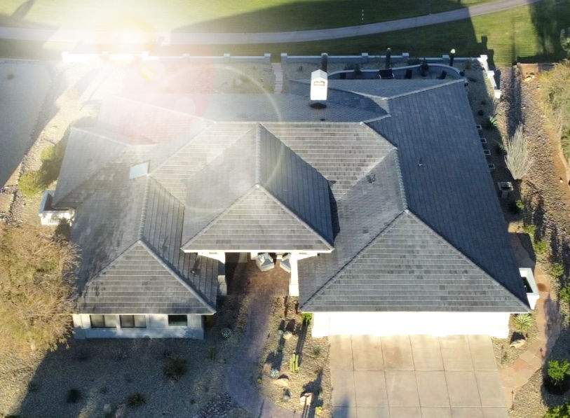 Residential home with a durable Voltaic concrete solar roof, showcasing storm resistance and stunning aesthetics.