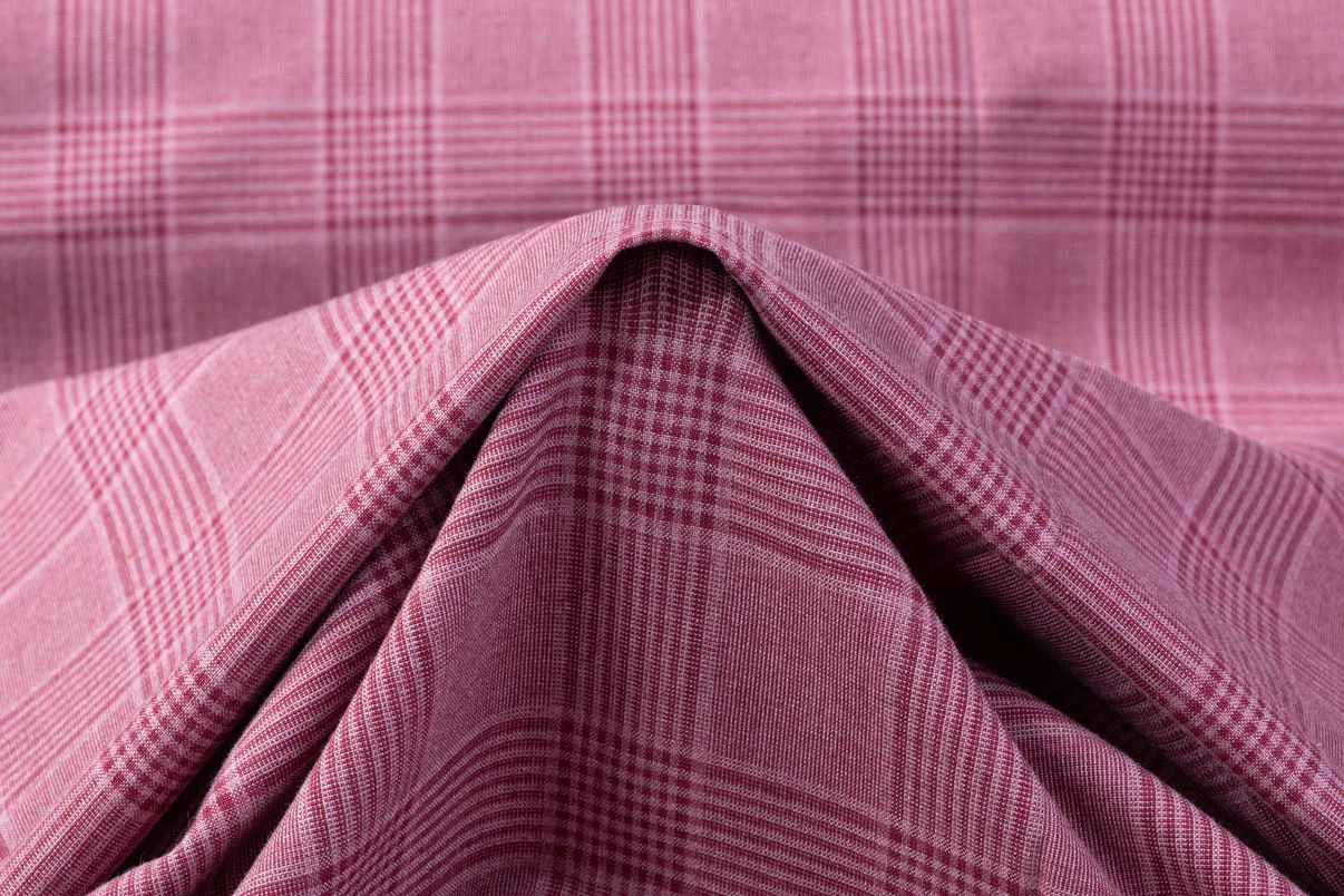 A baby pink and mauve plaid wool suiting available for a custom hunt coat