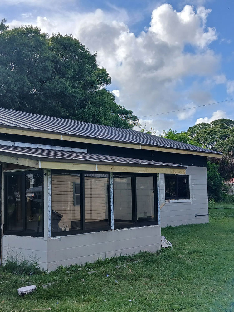 Home with a new standing seam metal roof
