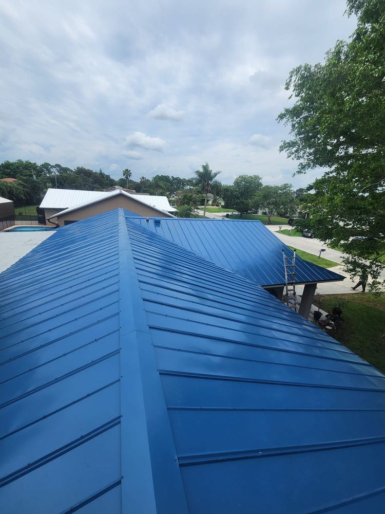 Ridge line of a new blue standing seam metal roof