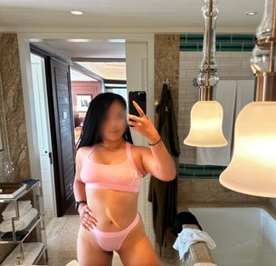 Audrey Astor in pink lingerie in her elegantly furnished Bangkok suite