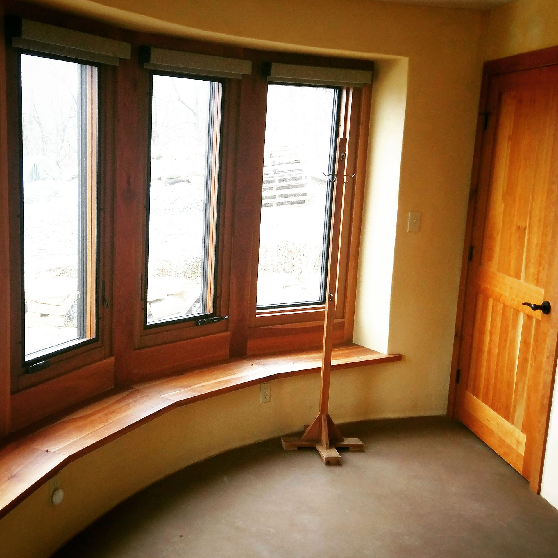 strawbale walls create deep window sills...ideal for extra seating