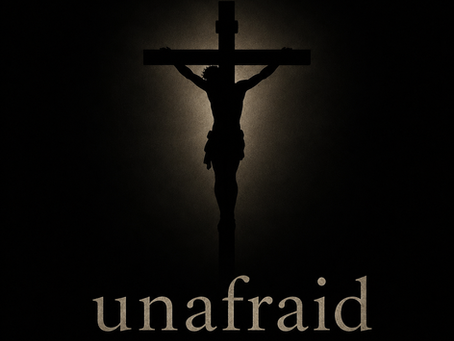 A silhouette of a crucifix with the word unafraid under it.