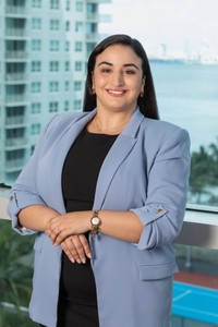 Sequor Law new attorney, professional headshot in blue blazer against Miami skyline