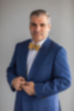 Giovanni Angles, Sequor Law international arbitration attorney, professional headshot in blue suit