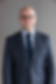 Christopher A. Noel, Sequor Law counsel, professional headshot in navy suit with glasses