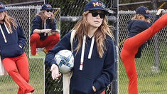 Olivia Wilde stretches before playing soccer with friends in Los Angeles to show off her flexibility